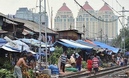 Traditional markets and modern high rises co-exist in the region's biggest economy